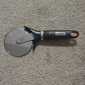 FREE W ANY PURCHASE!Farberware Black and Red Pizza Cutter